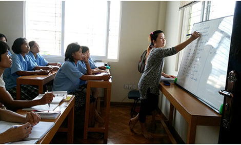 Some office cleaning staff at a training session